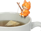 Tea Mates - 1pc Cute Fishing Dog - Tea Bag Holder and String Rest - Tea Accessory for Cup and Mug - Unique Funny Novelty Toy Gift Idea - Animal Figurine Drink Marker