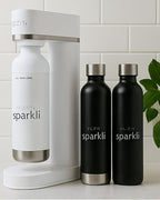 Fizzit Spärklï Carbonated Water Soda Maker in White with 2 Black Stainless Steel Bottles & 1 White Stainless Steel Bottle