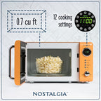 Nostalgia Retro Compact Countertop Microwave Oven - 0.7 Cu. Ft. - 700-Watts with LED Digital Display - Child Lock - Easy Clean Interior - Orange